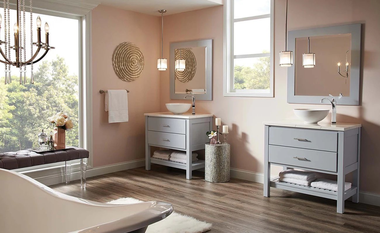 Warm neutral bathroom with gray vanities and vessel sinks