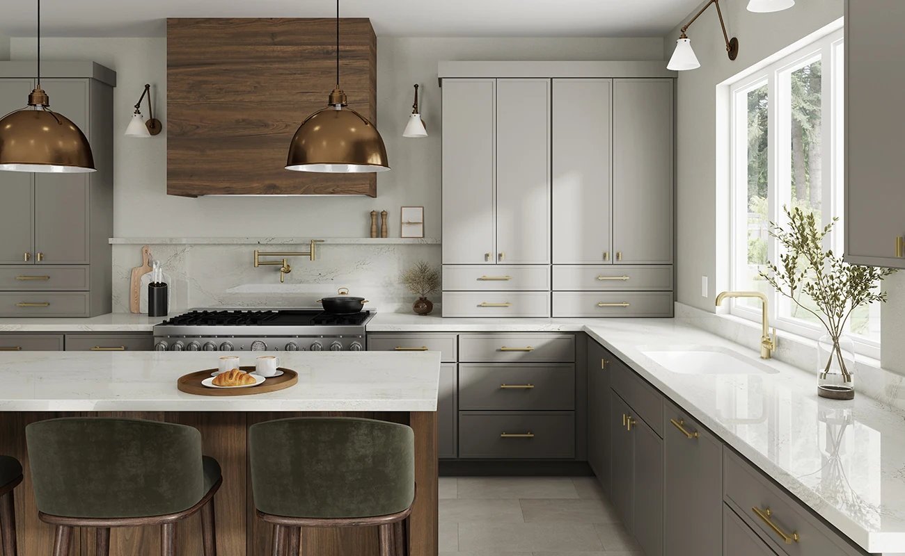 Warm gray kitchen with walnut hood and brass hardware