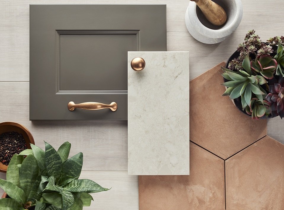 Taupe cabinet samples with brass hardware and warm stone