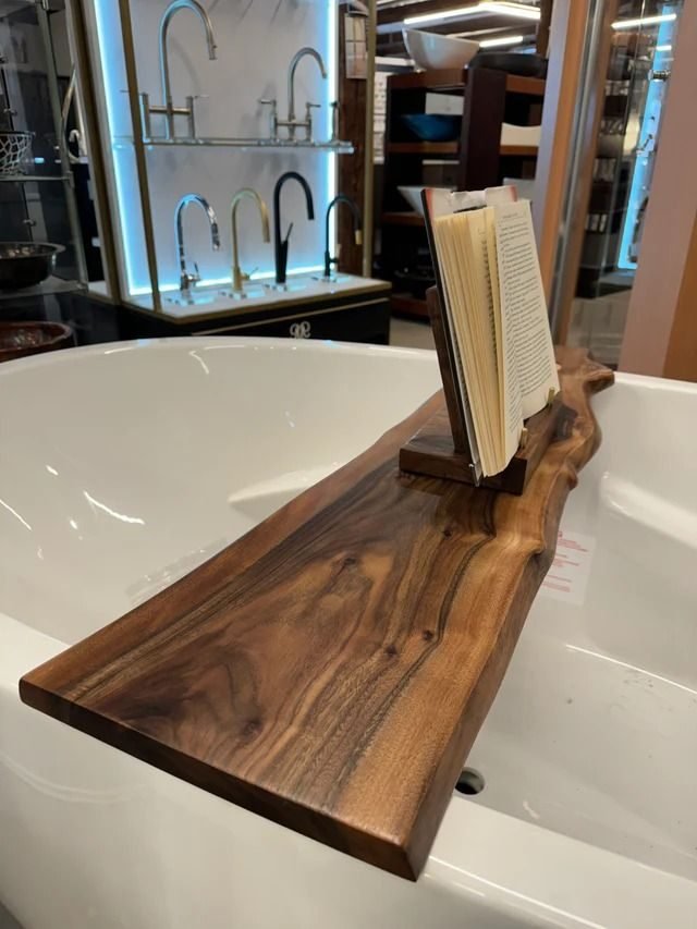 Handmade live-edge walnut bathtub caddy on a freestanding tub