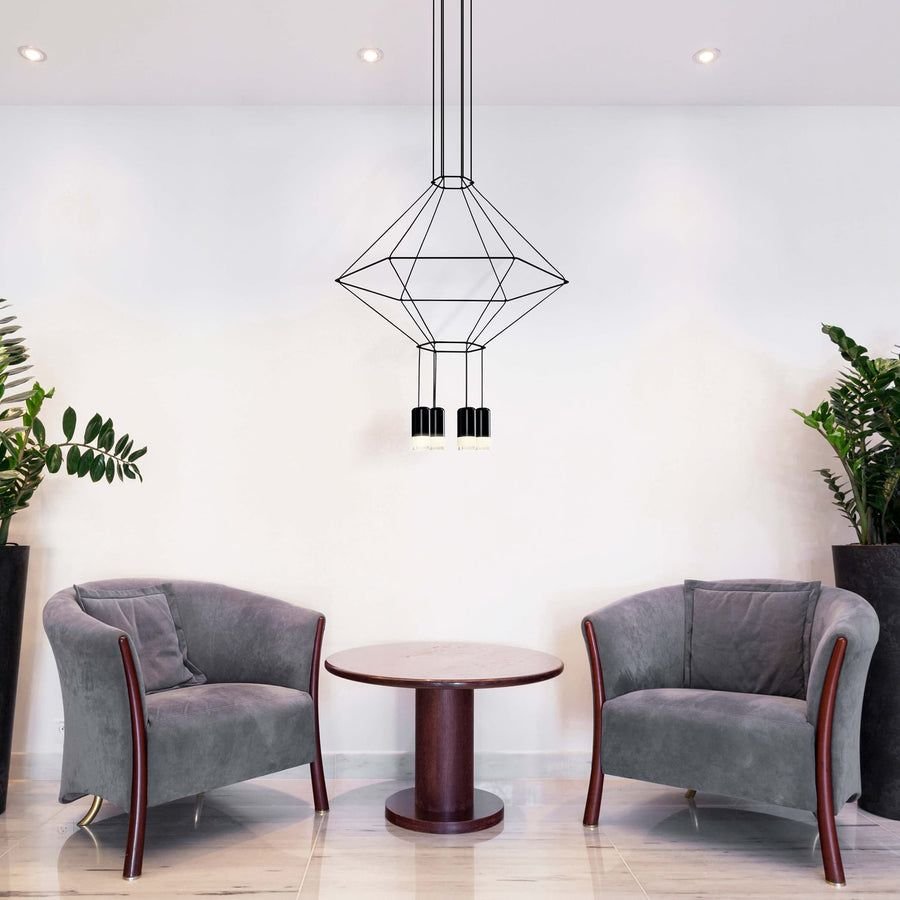 Airy living room with gray chairs and black geometric pendant
