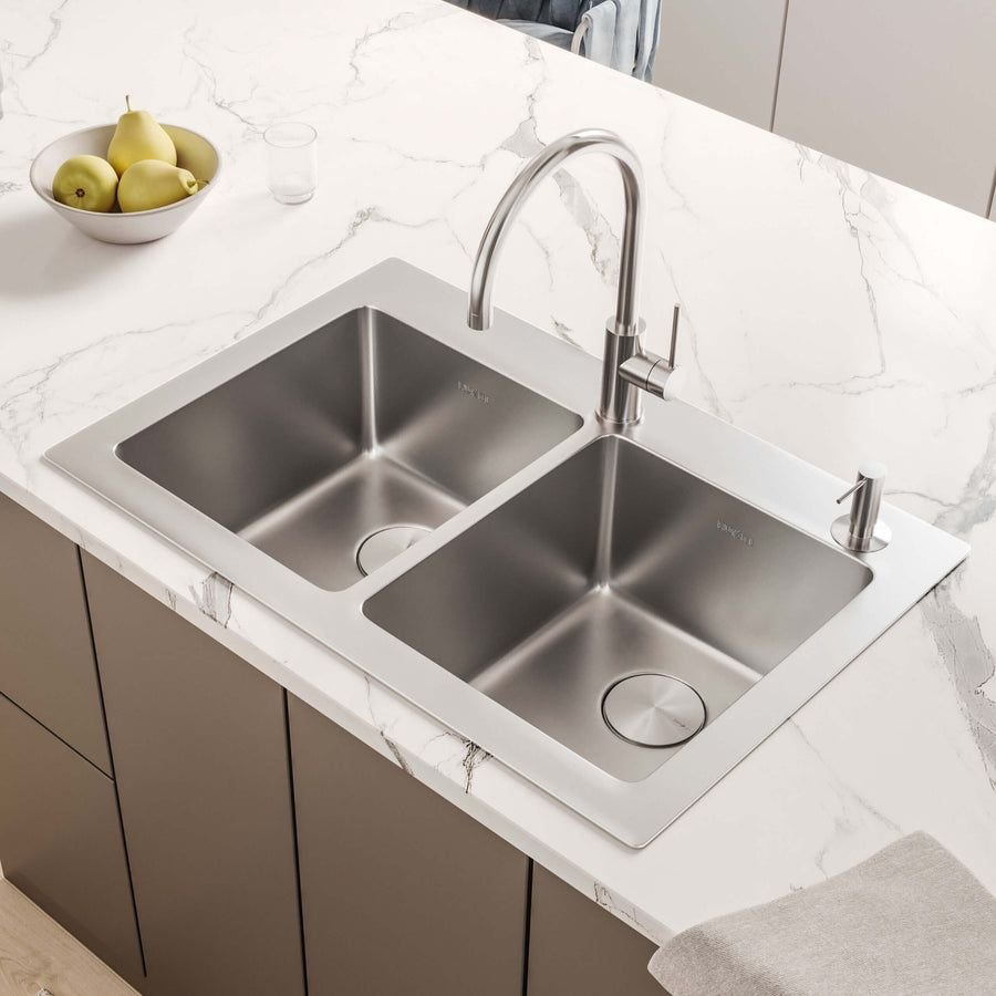 Double-bowl stainless sink in a veined marble counter