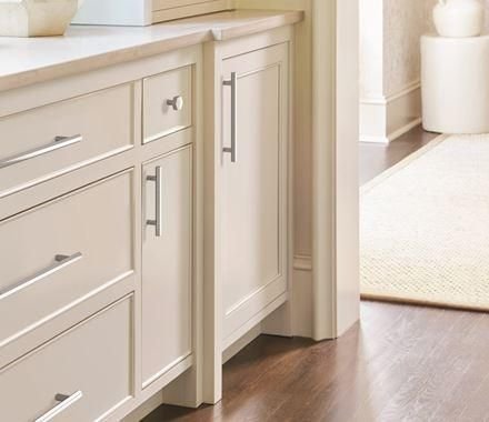 Cream shaker kitchen cabinets with polished chrome hardware