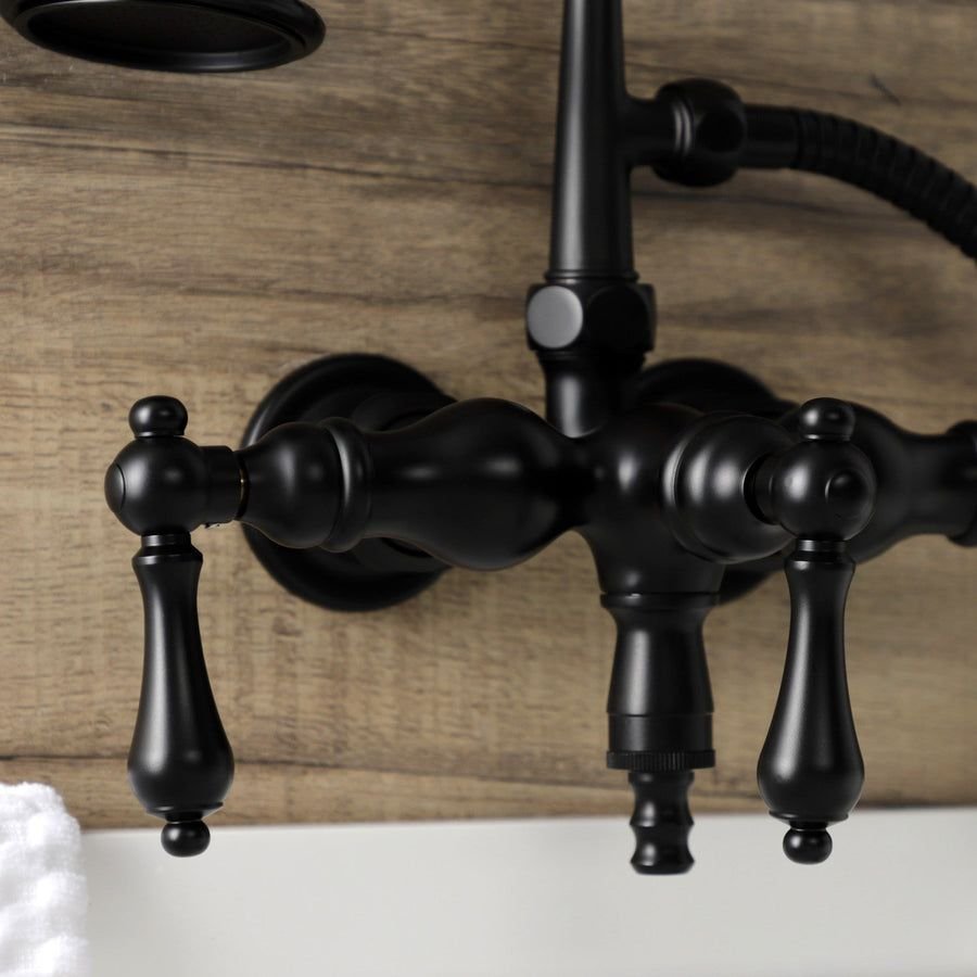 Matte black wall-mount tub faucet against warm wood planks