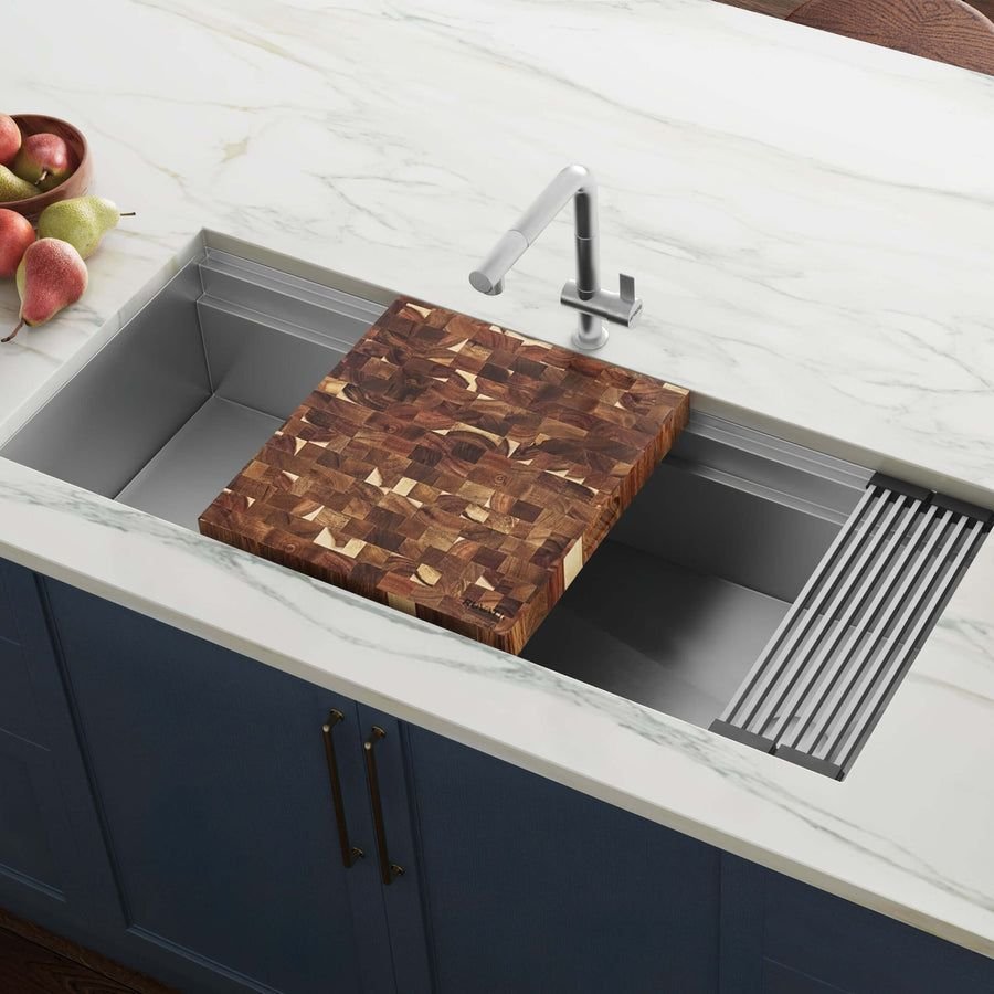 Cool gray kitchen sink with an acacia butcher block insert