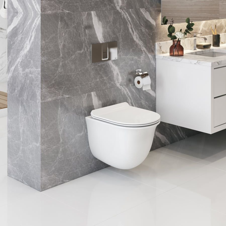 Wallhung white toilet against dramatic gray marble tile