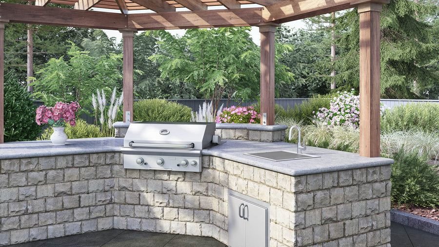 Greige stone outdoor kitchen with stainless grill and sink