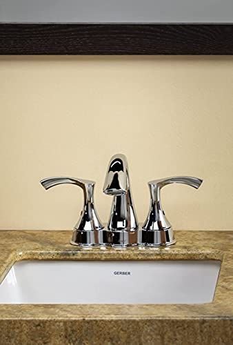 A chrome two-handle centerset faucet on a granite vanity top