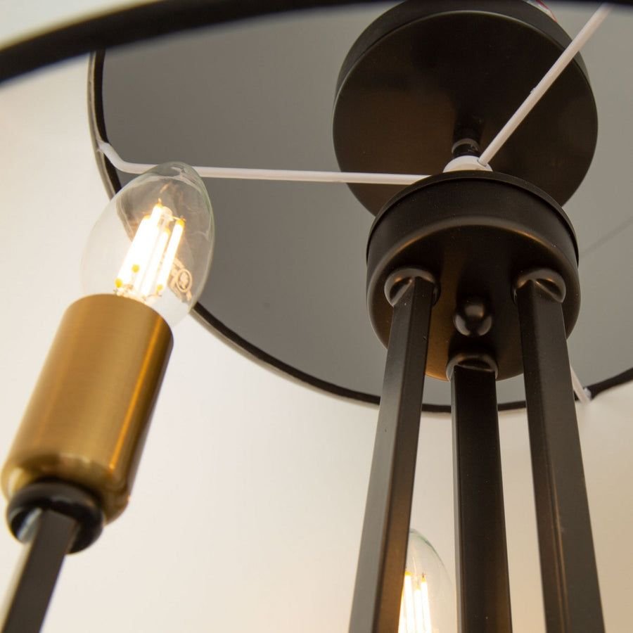 Dark bronze semi-flush mount with brass sockets and clear bulbs
