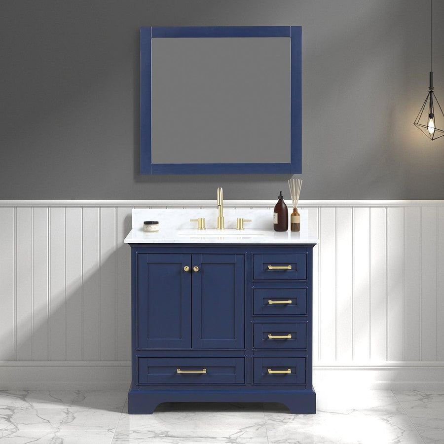 Navy blue bathroom vanity with marble top and brass hardware