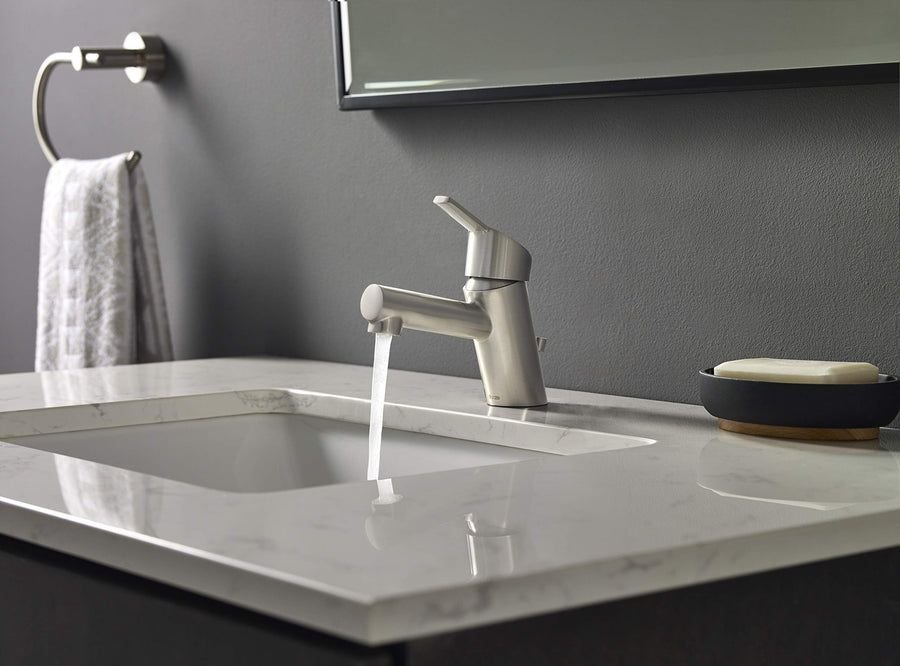 Gray vanity with marble basin and brushed nickel faucet