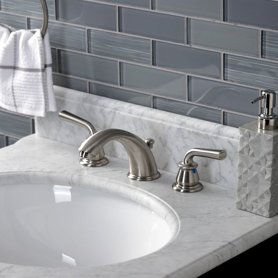 Gray tile bathroom vanity with marble and nickel faucet