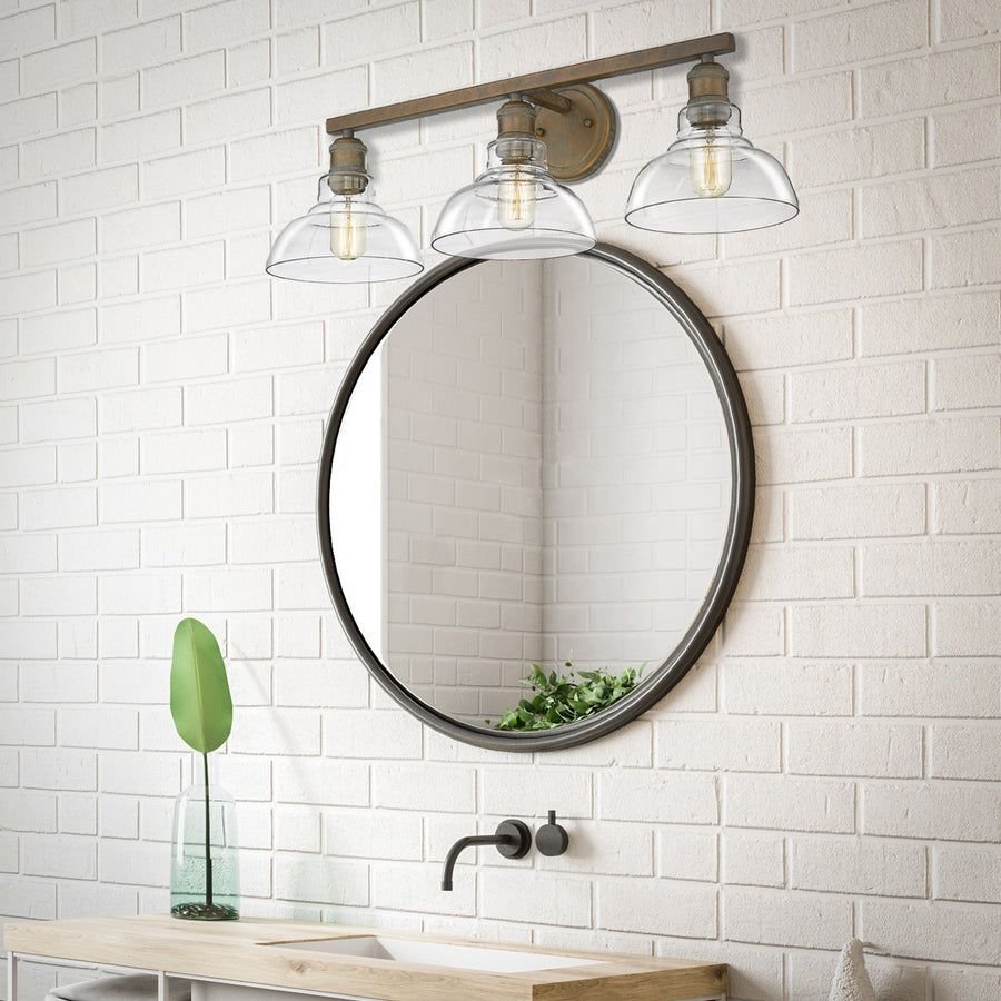 Bathroom idea with the Carver 3 Light Bath Vanity in Copper Patina with Clear Glass Shade, Golden Lighting