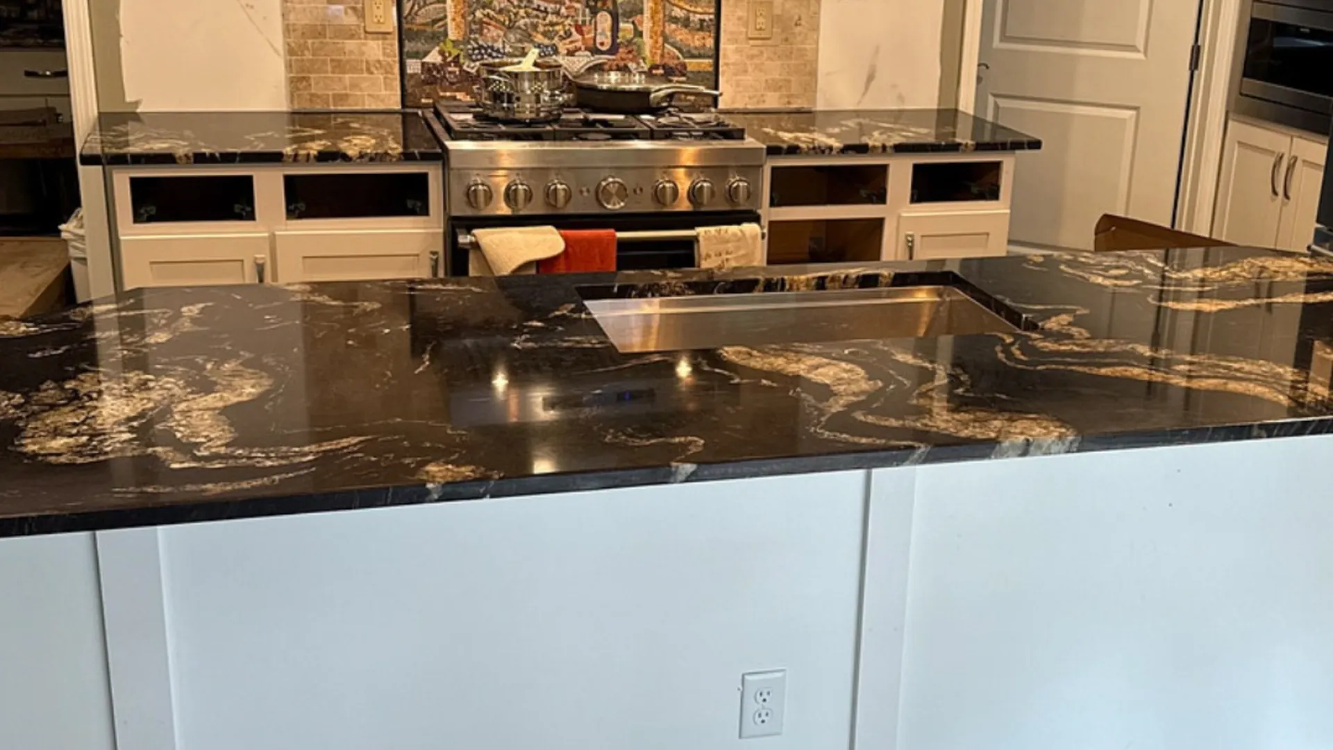 Dramatic black-and-gold granite island