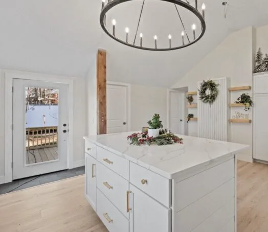 Marble island kitchen with chandelier