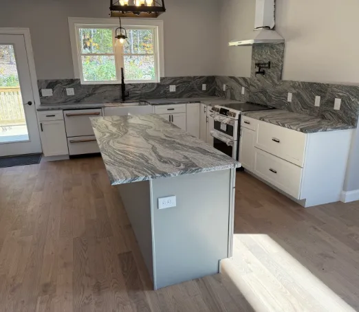 Fantasy Brown granite island with a full stone backsplash