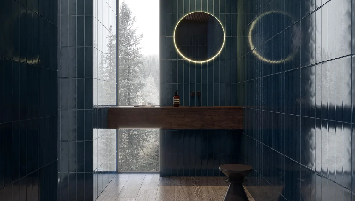 A bathroom with deep blue vertical wall tile