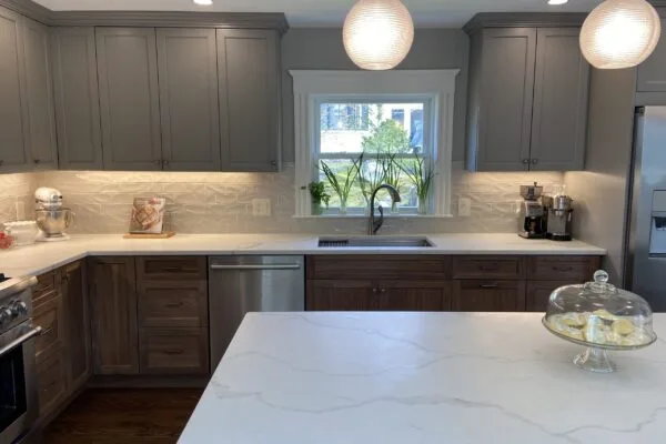 A tiled kitchen backsplash running from counter to upper cabinets