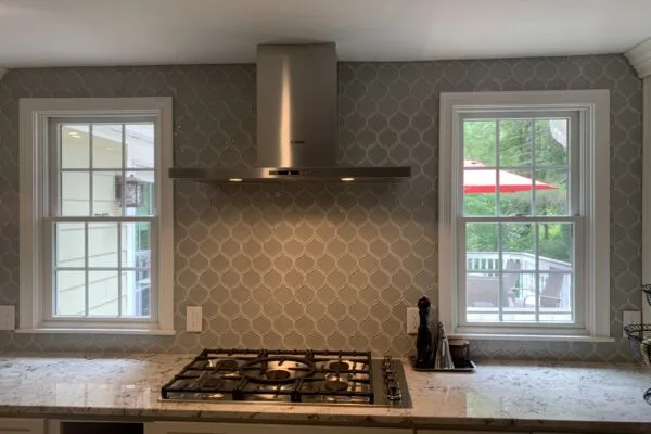 Mosaic accent behind a cooktop